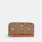 Coach - Long Zip Around Wallet In Signature Canvas With Orange Print (Preorden)