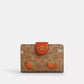 Coach - Medium Corner Zip Wallet In Signature Canvas With Orange Print (Preorden)