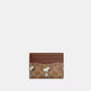 Coach X Peanuts Slim Id Card Case In Signature Canvas With Snoopy Print (Preorden)